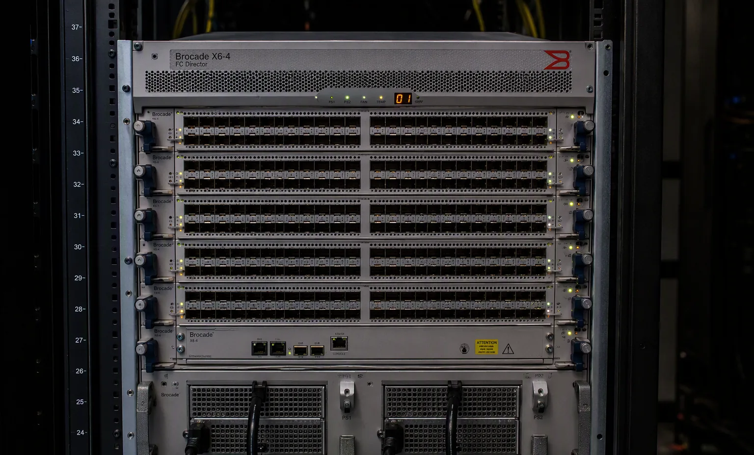 Brocade X6-4 FC director chassis 8U with port blades and SFPs, front view, dark data center.
