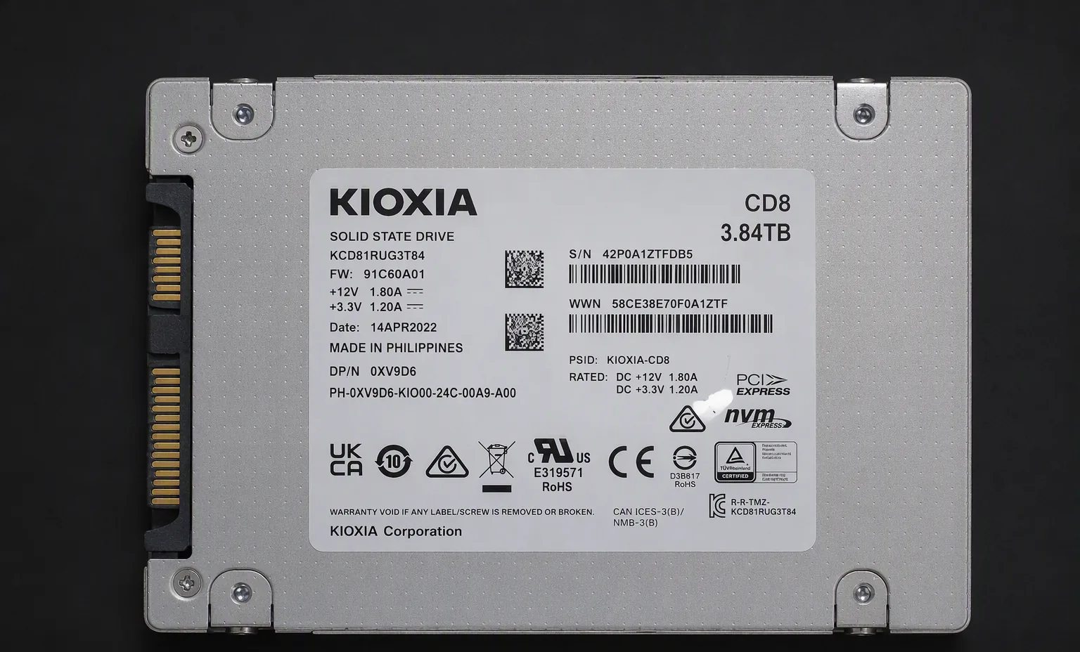 Kioxia CD8 3.84TB enterprise U.2 NVMe SSD, top view, dark studio.